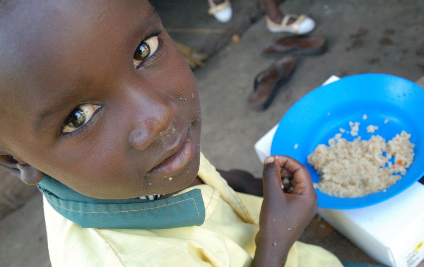  boy with bowl of rice