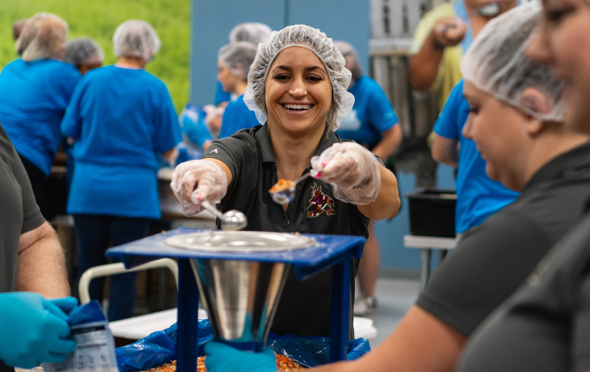 Volunteer packing meals at FMSC