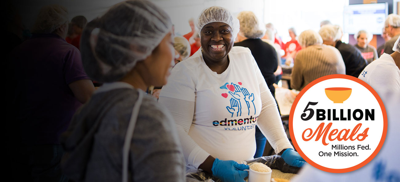 Volunteers packing FMSC food at a MobilePack event