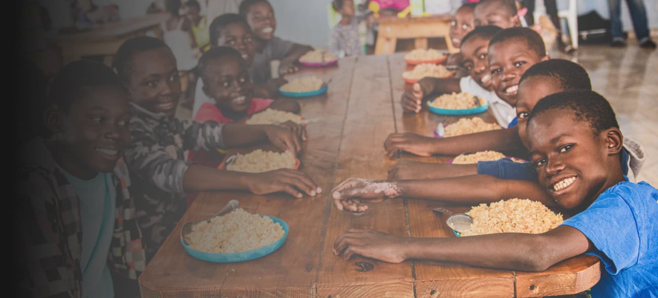 kids around a table eating FMSC food