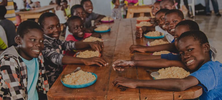 kids around a table eating FMSC food