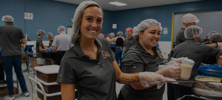 Volunteers packing FMSC meals
