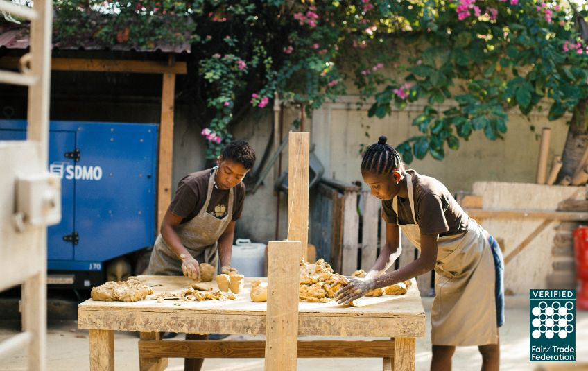 FMSC MarketPlace artisan partners at work crafting goods. The photo has the Fair Trade Federation verified seal in the corner.